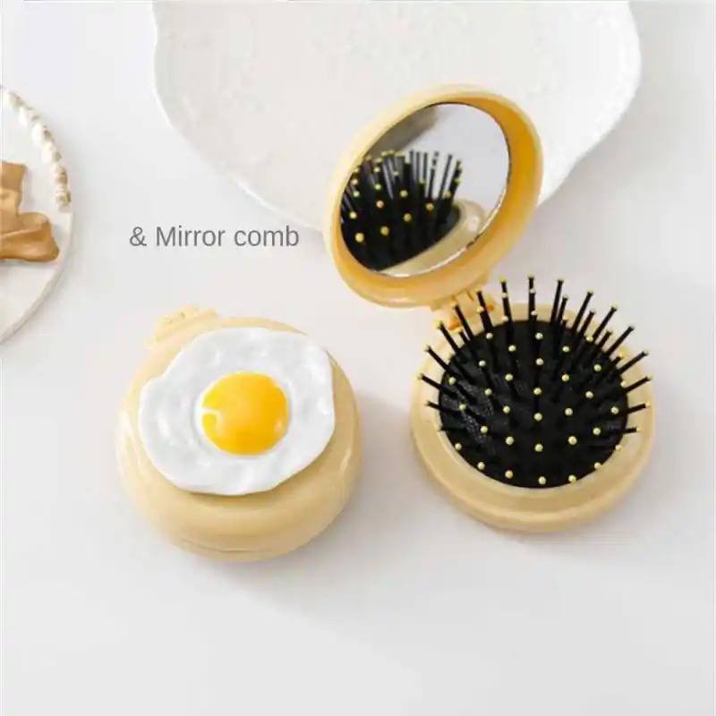 Egg shape massage mirror comb